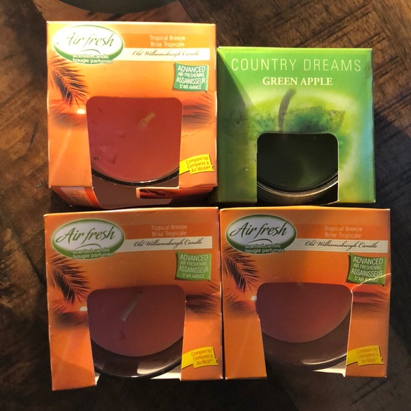 3 tropical breeze candles and one small one - Picture 1 of 3